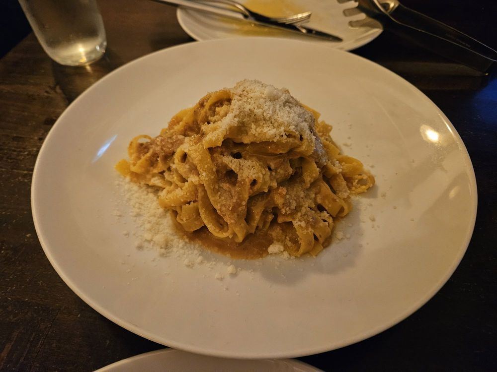 Tagliatelle alla bolognese with grated cheese